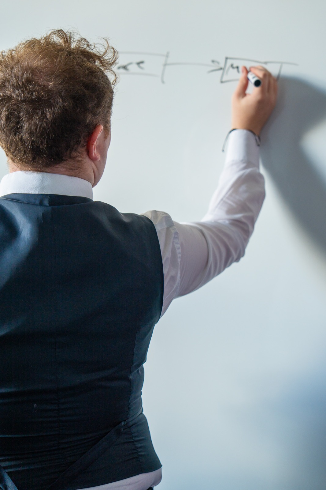 Feldon Haynes mapping a client growth strategy on a whiteboard