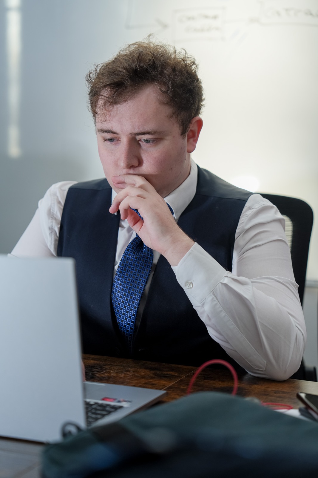 Feldon Haynes reviewing client strategy at his laptop